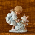 Dievčatko so zajkom s vrecom plným darčekov 11cm